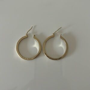 Gold coach hoop earrings